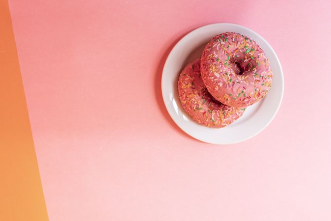 Pink doughnuts in a colorful background