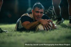 Rugby player making a touch down during the match 0vnYp0