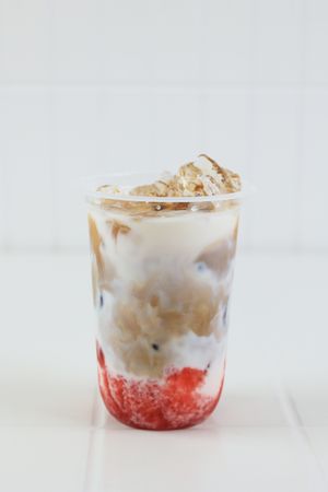 Iced Strawberry Milk Cafe  Latte on Table