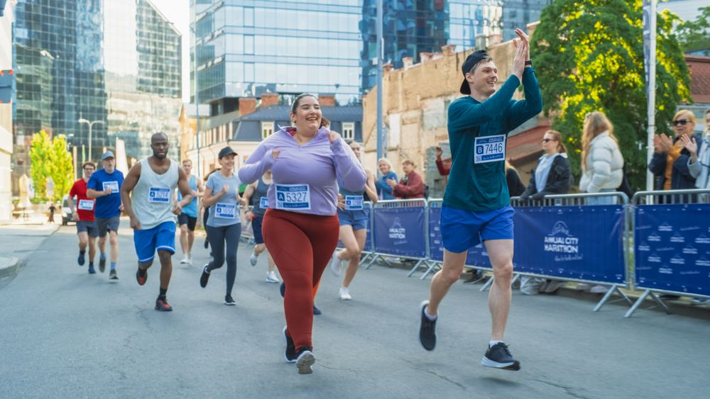 Friendly City Marathon Participants Waving at the Audience