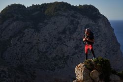 Male hiker admiring picturesque mountains