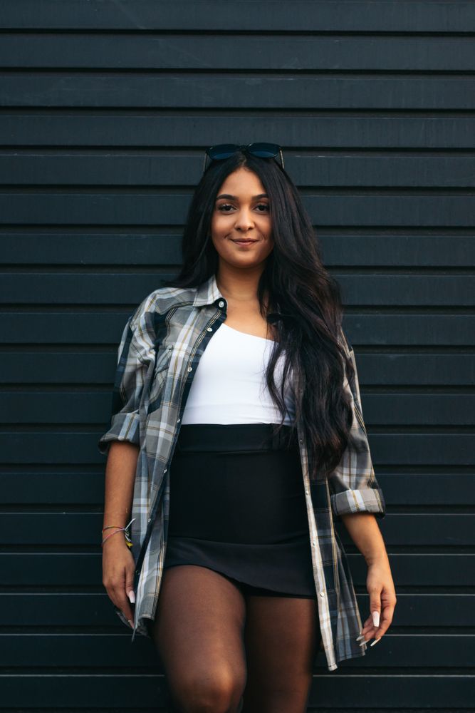 Portrait of a brunette woman outdoors against dark background