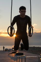 Sportsman training on gymnastic rings