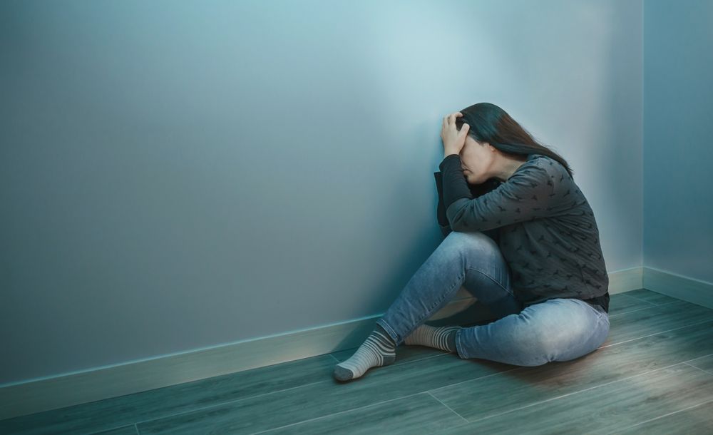 Unrecognizable woman with hands in head