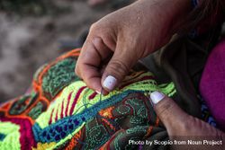 Person making colorful Peruvian embroidery bDALV0