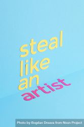 Steal like an artist quote made of paper over blue background 4NQ9Z5