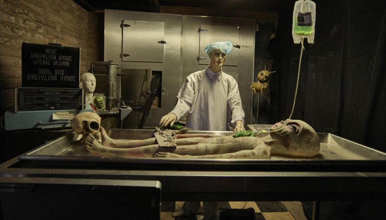 Space alien figures being dissected inside Fox Cave in Ruidoso, New Mexico