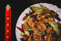 Served delicious spicy lamb in Asian restaurant