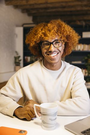 Portrait of a man in a living room.