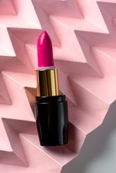 Lipstick on raised pink chevron. Product and make up concept