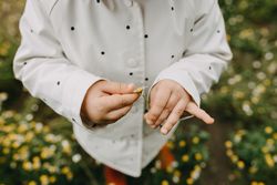 Close up of child holding a daisy