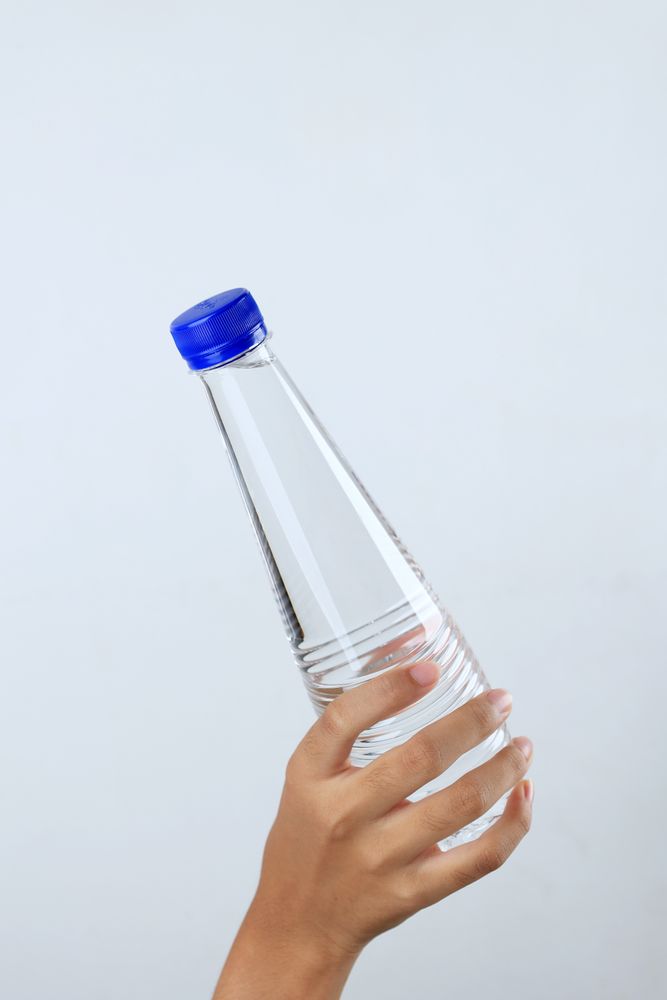 Woman Hand Hold Mineral Water Bottle