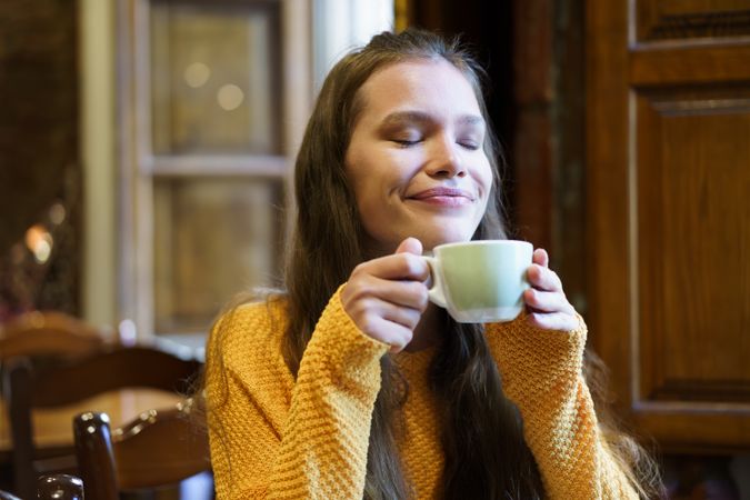 Savoring a Cozy Moment While Enjoying a Warm and Comforting Drink of Your Choice