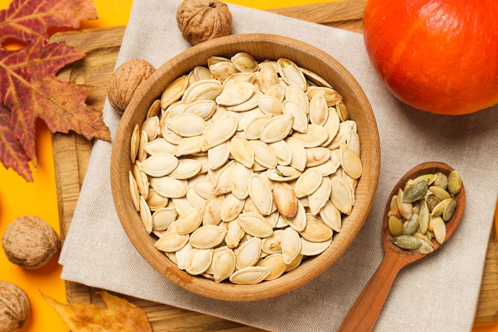 Cooking ingredients for fall season - pumpkin seeds, pumpkin