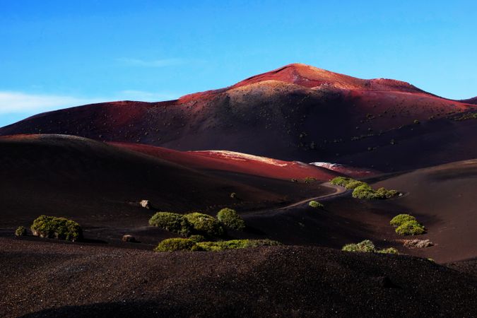 Picturesque view of volcanic terrain with solidified lava in wild area
