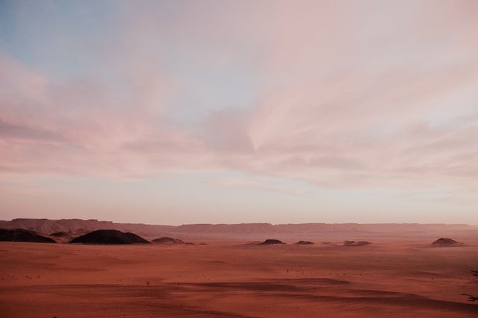 Sunset sky over hills in desert