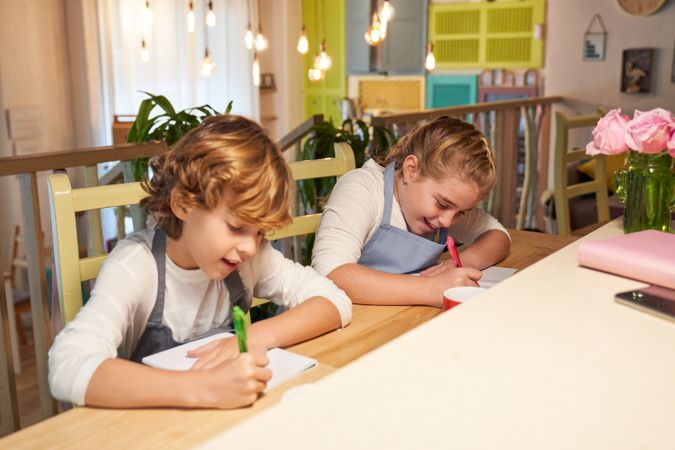 Attentive kids having lesson at table