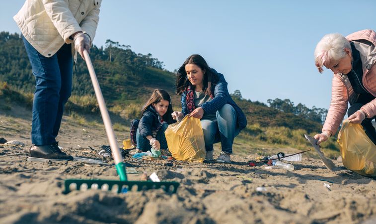 Female volunteers cleaning the beach