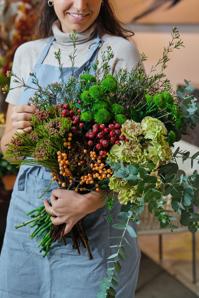 Crop woman with flower bouquet