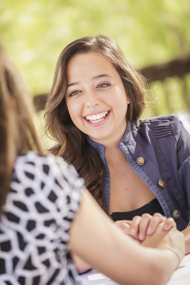 Female Laughing Sitting Outside