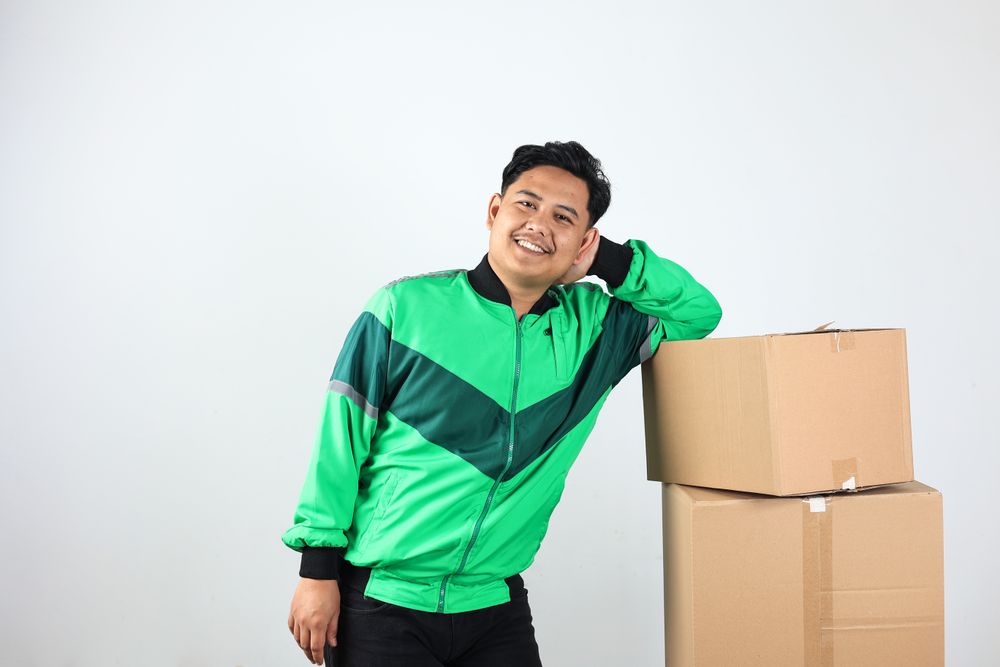 Asian Online Driver Lean on Box, Gojek Grab Delivery Concept