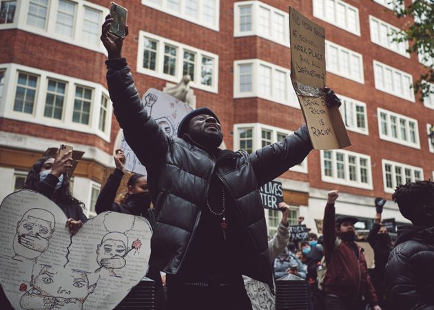 London, England, United Kingdom - June 6th, 2020: Man with arms outstretched and sign at BLM protest