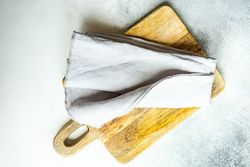Wooden board on marble counter