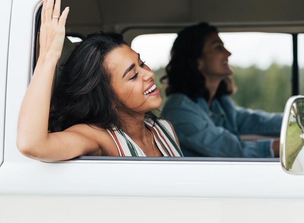 Two happy women on a road trip