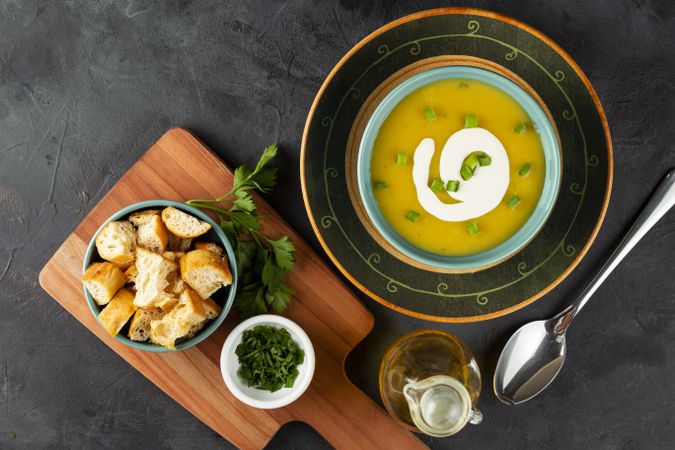 Bowl with pumpkin soup on the table.