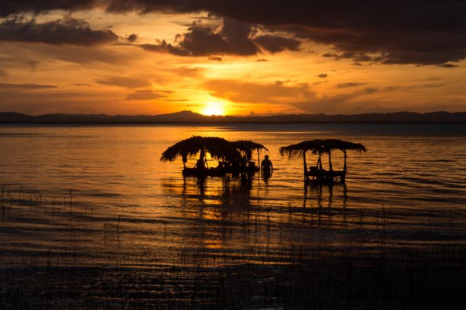 Laundry in sea at sunset