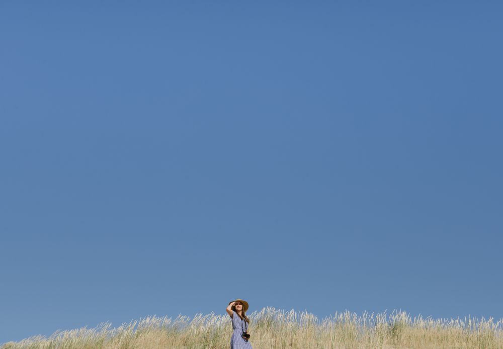 Young female photographer on forest