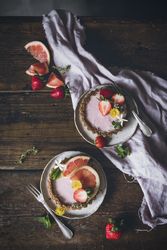 Strawberry and citrus cake served on wooden table