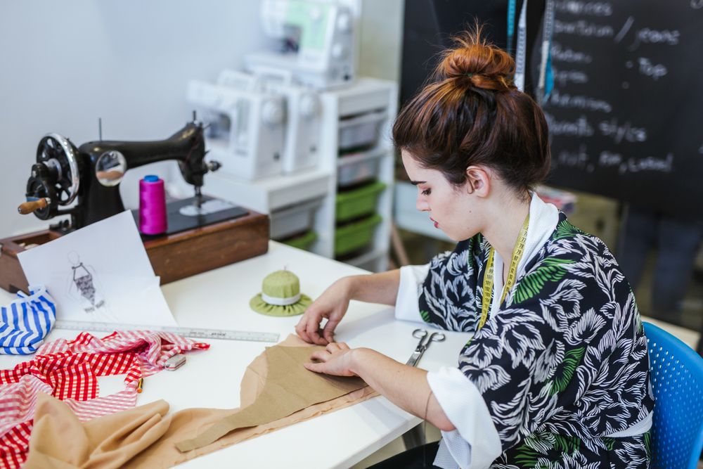 Woman in a sewing school