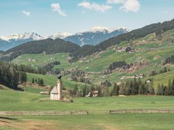Small beautiful village between mountains with snow