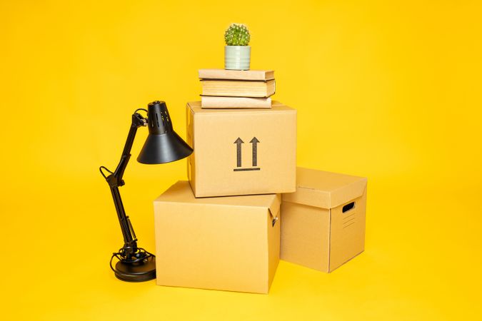 Concept of move with boxes on yellow background
