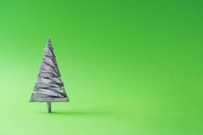 Wooden Christmas tree decoration with green background