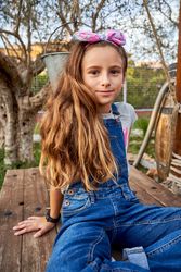 Cute girl sitting in park