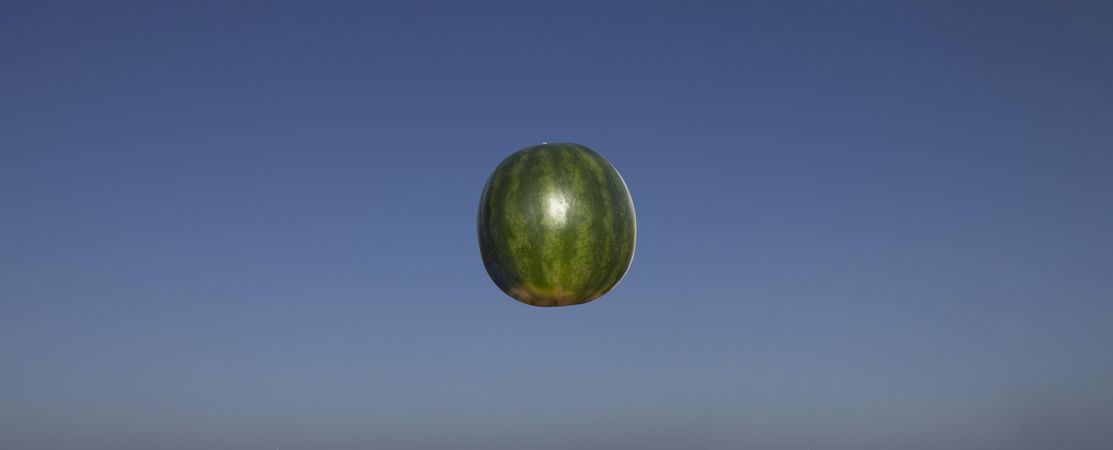Floating watermelon in sky