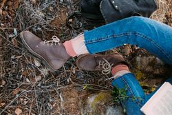 Woman in jeans with legs crossed