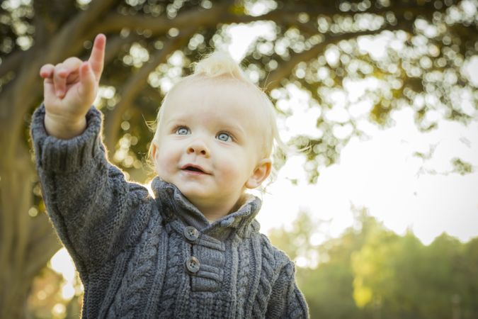 Adorable Blonde Baby Boy Outdoors at the Park.