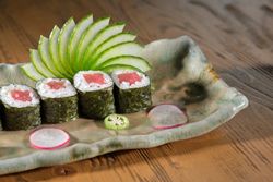 Set of fresh tuna rolls on marble plate
