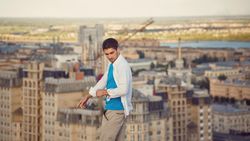 Man strolls on roof and looks back