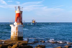Lighthouse on rocky coastline