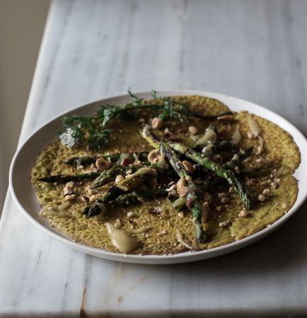 Served vegetarian crepe with oats and asparagus
