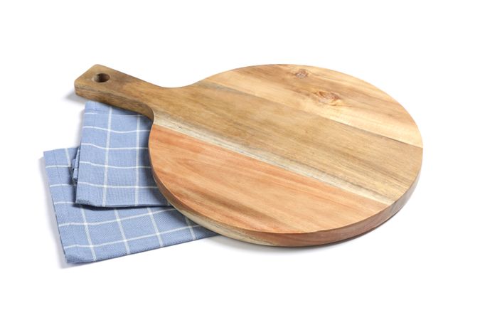Cutting board with kitchen towel isolated on studio background