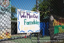 Handmade sign from teachers to students hanging on schoolyard fence 5RVmA5