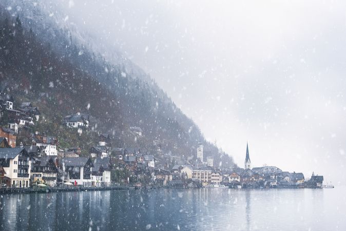 Austrian mountain town under snowfall