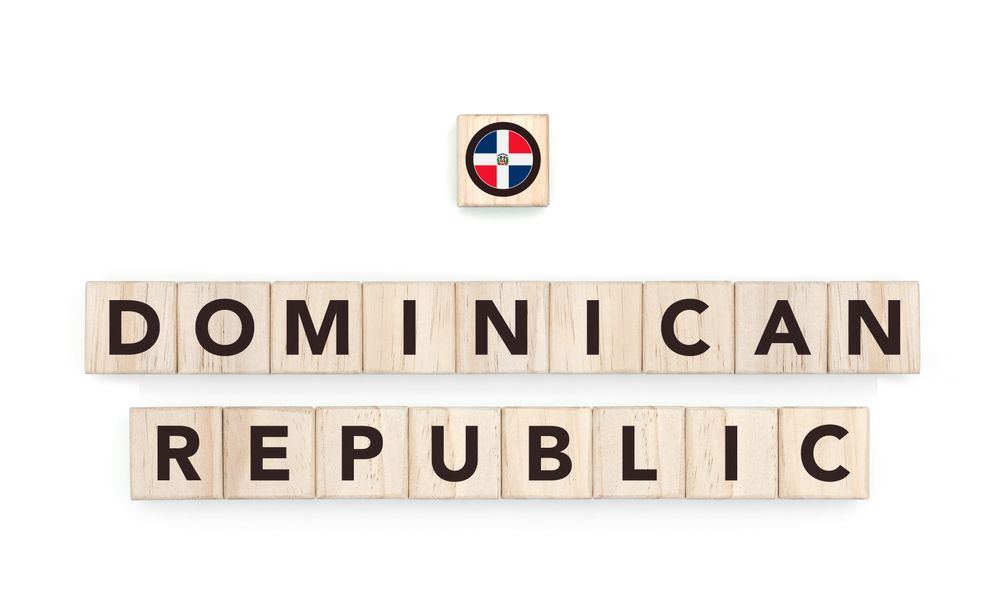 Wooden blocks bearing the name and flag of Dominican Republic. Dominican and Caribbean Culture, national identity, travel, and geography in a copy space design.