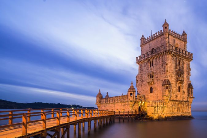 Medieval stone tower in dusky seascape