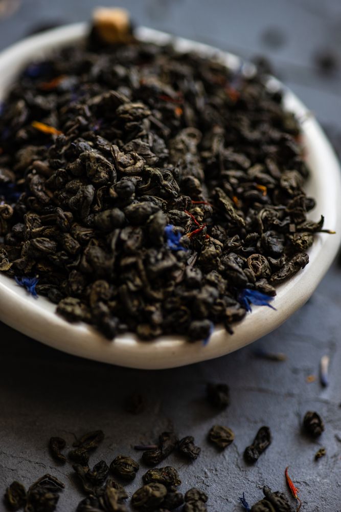 Dried green tea in a bowl
